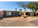 Features mature trees, desert landscaping, and a driveway leading to the entrance at 2939 E Paradise Ln, Phoenix, AZ 85032