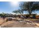 Features mature trees, desert landscaping, and a long driveway leading to the home at 2939 E Paradise Ln, Phoenix, AZ 85032