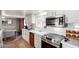 Updated kitchen with white cabinetry, stainless steel appliances, and subway tile backsplash at 2939 E Paradise Ln, Phoenix, AZ 85032