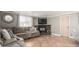 Inviting living room featuring a stone fireplace, plush seating, and natural light at 2939 E Paradise Ln, Phoenix, AZ 85032