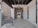 Inviting outdoor hallway with elegant lighting, stylish seating, and tiled flooring, creating a welcoming space for residents and guests at 3550 E Audrey Dr, San Tan Valley, AZ 85143