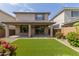 An ample covered patio and a large backyard with beautiful artificial turf provides low-maintenance landscaping at 3551 E Louise Dr, Phoenix, AZ 85050