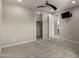 This bedroom has neutral colors, a ceiling fan, and an attached bath with a walk-in closet at 3551 E Louise Dr, Phoenix, AZ 85050