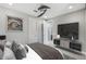 Cozy bedroom featuring a large TV and decoratively appointed with modern furnishings, art, and finishes at 3551 E Louise Dr, Phoenix, AZ 85050
