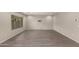 Empty bonus room featuring tile floors, neutral walls, large window, and TV mount at 3551 E Louise Dr, Phoenix, AZ 85050