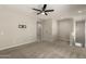 Large bonus room featuring neutral walls and carpet flooring with staircase and TV mount at 3551 E Louise Dr, Phoenix, AZ 85050