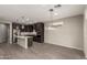Open-concept kitchen featuring a large island, stainless steel appliances, and dark wood cabinetry at 3551 E Louise Dr, Phoenix, AZ 85050