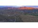 Expansive aerial view of the desert landscape dotted with homes nestled among cacti and vegetation at 39332 N Old Stage Rd, Cave Creek, AZ 85331