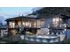 Stunning modern home features a private pool, outdoor seating, and a luxurious two-story design at 39332 N Old Stage Rd, Cave Creek, AZ 85331