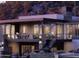 Modern home features a stone facade, outdoor living areas, sleek design, and hillside setting at 39332 N Old Stage Rd, Cave Creek, AZ 85331