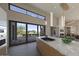 Bright and airy kitchen with marble countertops, modern appliances, and outdoor access at 39332 N Old Stage Rd, Cave Creek, AZ 85331