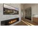 Contemporary living room featuring a modern fireplace, wine storage, and stylish decor at 39332 N Old Stage Rd, Cave Creek, AZ 85331
