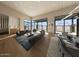 Spacious living room with floor to ceiling windows, hardwood floors and modern decor at 39332 N Old Stage Rd, Cave Creek, AZ 85331