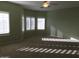 Large bedroom with neutral colors and many windows letting in plenty of sunlight at 42920 N Raleigh Ct, Anthem, AZ 85086