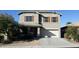 Two-story home featuring a neutral color scheme, shuttered windows, and desert landscaping at 42920 N Raleigh Ct, Anthem, AZ 85086