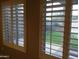 Windows looking out onto backyard, featuring white plantation shutters at 42920 N Raleigh Ct, Anthem, AZ 85086