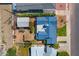 Aerial view of a single-Gathering home featuring a new blue roof, mature trees, and a fenced backyard at 440 W 1St W St, Mesa, AZ 85201