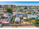 Charming home featuring a well-maintained yard, mature trees, and an outdoor pergola, viewed from above at 440 W 1St W St, Mesa, AZ 85201