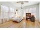 Inviting bedroom filled with natural light, featuring hardwood floors and neutral-toned walls at 440 W 1St W St, Mesa, AZ 85201