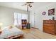 Bright bedroom with hardwood floors, closet, and a large window at 440 W 1St W St, Mesa, AZ 85201