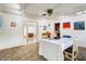 Bright dining room with white walls, eclectic artwork, and a dining set with seating for four at 440 W 1St W St, Mesa, AZ 85201