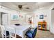 Bright dining room with a ceiling fan, track lighting, and views to the additional rooms at 440 W 1St W St, Mesa, AZ 85201