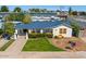 Charming single-story home featuring a blue roof, freshly cut grass, and mature landscaping at 440 W 1St W St, Mesa, AZ 85201