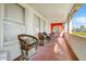 Inviting covered porch with unique chairs and a colorful mural, perfect for outdoor relaxation and artistic flair at 440 W 1St W St, Mesa, AZ 85201