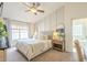 Serene bedroom with neutral tones, paneling, and a plush upholstered bed at 486 E Devon Dr, Gilbert, AZ 85296