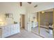 Bedroom view including crib, dresser, closet, and neutral wall colors at 486 E Devon Dr, Gilbert, AZ 85296