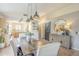 Dining area with a wooden table, buffet, and decorative mirror, adjacent to the kitchen at 486 E Devon Dr, Gilbert, AZ 85296