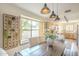 Cozy dining area with a wooden table, pendant lights, and window seat at 486 E Devon Dr, Gilbert, AZ 85296