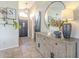 Beautiful foyer featuring a modern light fixture, decorative shelves, and rustic wood accents at 486 E Devon Dr, Gilbert, AZ 85296