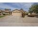 Charming single-story home featuring a well-maintained yard and attached two-car garage at 486 E Devon Dr, Gilbert, AZ 85296