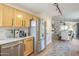 Modern kitchen with stainless steel appliances and light wood cabinets at 486 E Devon Dr, Gilbert, AZ 85296