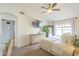 Spacious main bedroom featuring a ceiling fan, dresser, mounted TV, and a large window at 486 E Devon Dr, Gilbert, AZ 85296