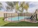 Backyard swimming pool with secure fencing and lounge chairs, provides a safe and relaxing outdoor oasis at 486 E Devon Dr, Gilbert, AZ 85296