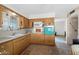 Functional kitchen featuring ample cabinetry, linoleum flooring, and a vintage oven at 5463 E Albany St, Mesa, AZ 85205