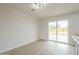 Well-lit dining room with sliding glass doors, seamlessly connecting indoor and outdoor spaces for an inviting atmosphere at 562 N 104Th St, Mesa, AZ 85207