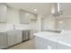 Stylish kitchen with stainless steel appliances, white countertops, and gray cabinetry, offering a modern culinary space at 562 N 104Th St, Mesa, AZ 85207