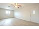 Inviting living room with new flooring, a window, and a well-maintained entrance door, creating a welcoming ambiance at 562 N 104Th St, Mesa, AZ 85207