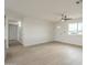 Bright living room with neutral walls, modern ceiling fan, and lots of natural light at 562 N 104Th St, Mesa, AZ 85207