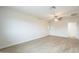 Bright living room features a ceiling fan, neutral walls, and new flooring creating a serene and inviting atmosphere at 562 N 104Th St, Mesa, AZ 85207