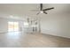 Bright living room flowing into a modern kitchen with an island and stainless steel appliances at 562 N 104Th St, Mesa, AZ 85207