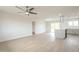 Bright living room flowing into a modern kitchen with an island and stainless steel appliances at 562 N 104Th St, Mesa, AZ 85207