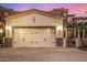 Two car garage with paneled doors on a brick paved driveway at 6202 E Mckellips Rd # 46, Mesa, AZ 85215