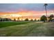 Beautiful community golf course with colorful sunset at 6202 E Mckellips Rd # 46, Mesa, AZ 85215