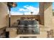 Close up of outdoor kitchen with built in stainless steel barbeque grill and counter space at 6202 E Mckellips Rd # 46, Mesa, AZ 85215