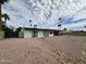 Modern desert backyard with palm trees, minimalist landscaping and direct access to the house at 6429 E Jean Dr, Scottsdale, AZ 85254