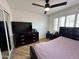 Bedroom featuring a ceiling fan, tile floors, and built in shutters at 6429 E Jean Dr, Scottsdale, AZ 85254